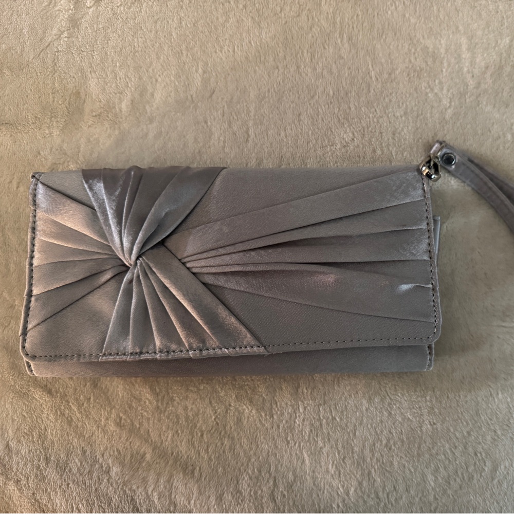 Silver gray satin clutch bag with a mirror and lipstick holder.